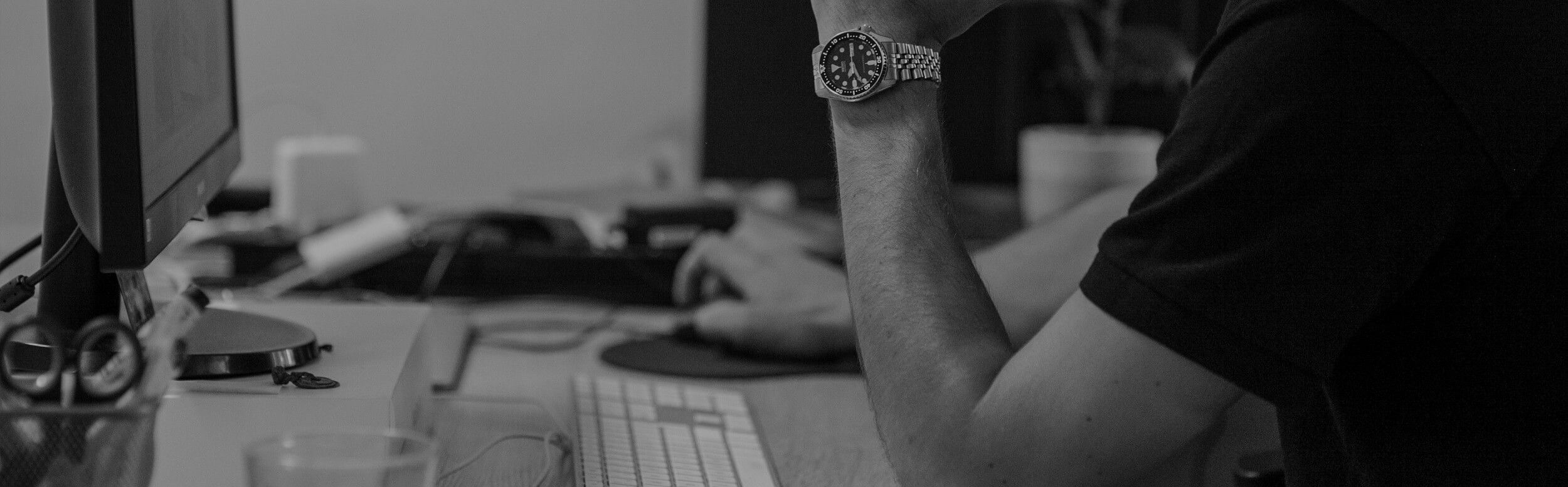 man working on the computer detail on watch