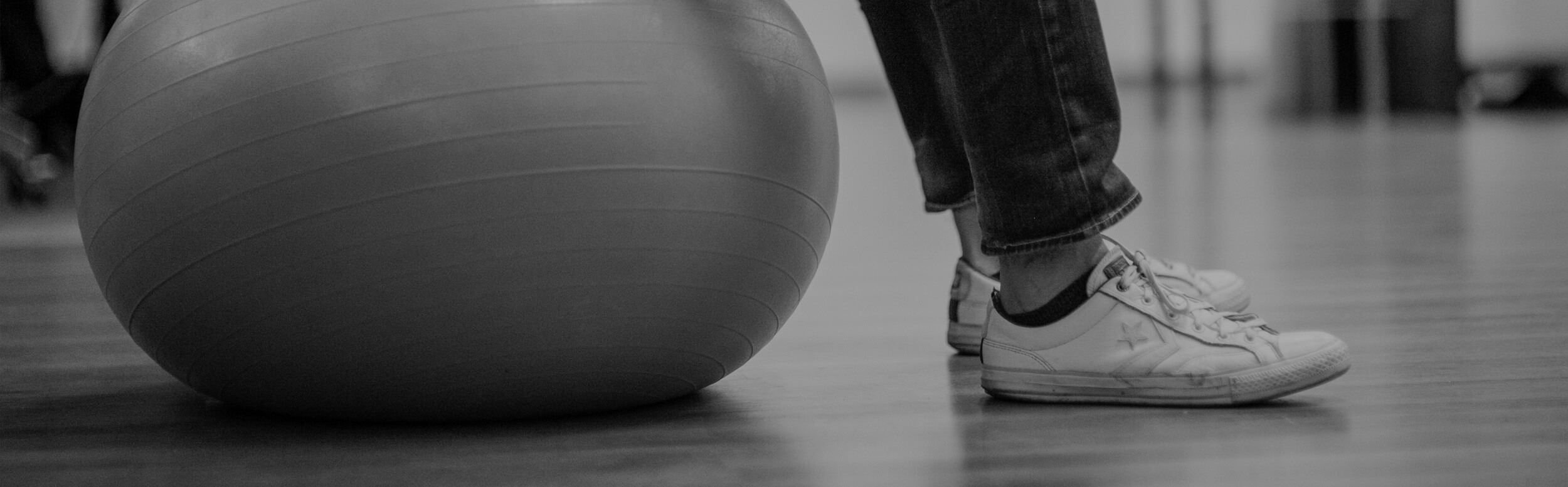 Man sitting on the exercise fitball