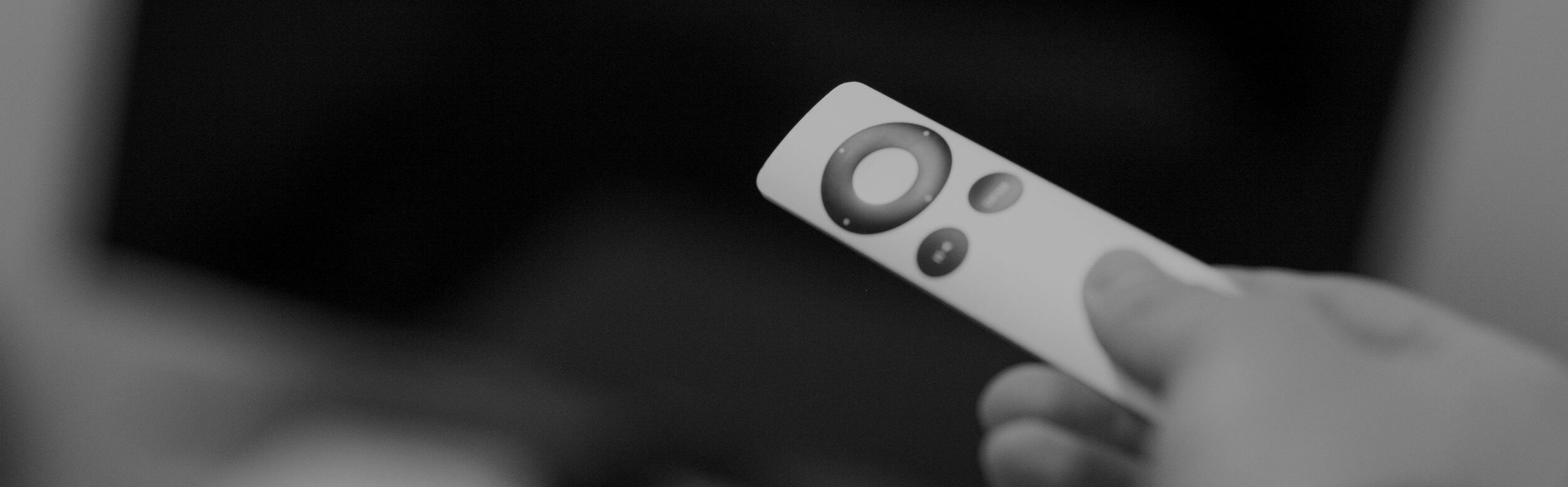 TV remote in man's hand